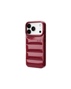 The Puffer Case® - Cola, angled view | phone-size_iphone-17-pro|